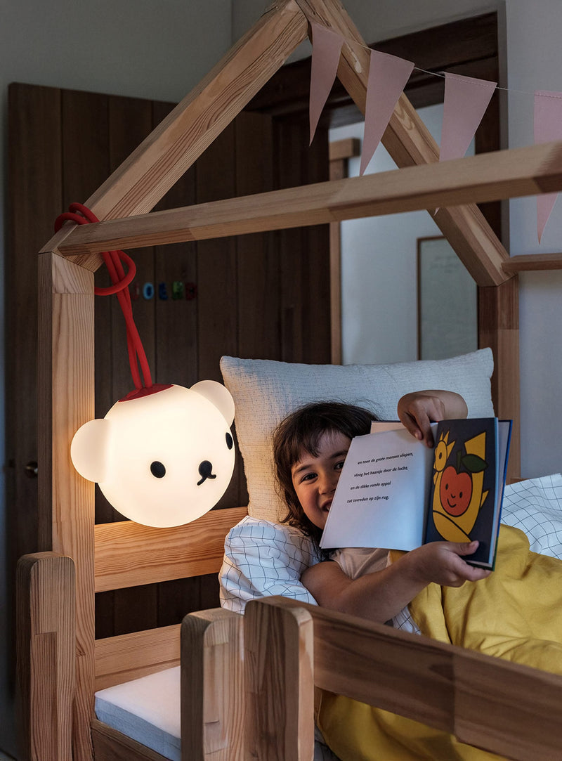 Fatboy Bolleke x Boris lamp adding a warm glow and playful charm to a cozy living room or reading nook.