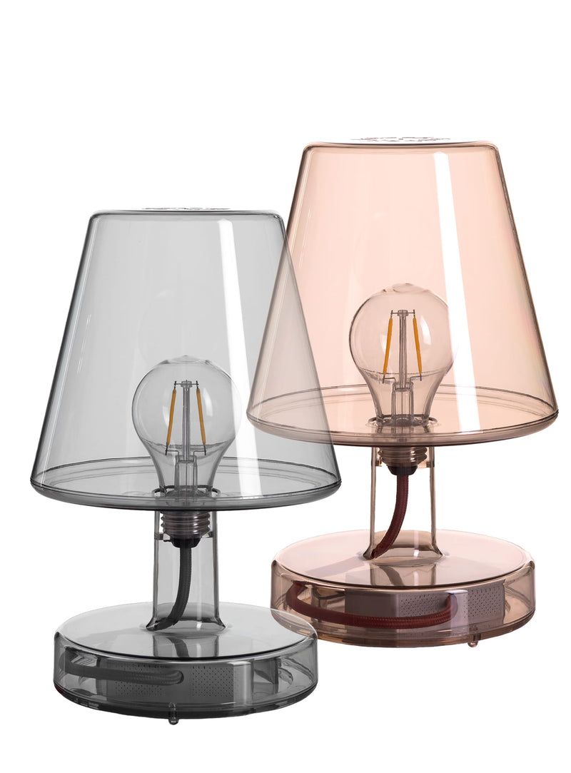 Set of 2 Fatboy Transloetje table lamps in transparent grey & brown color, featuring wireless, touch-controlled LED lighting with 3 brightness settings for modern Canadian interiors.