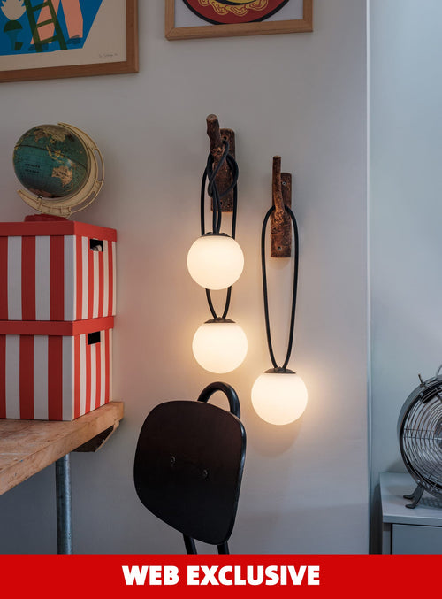 Set of 3 Bolleke Mini lamps by Fatboy hanging outdoors for ambient evening lighting.