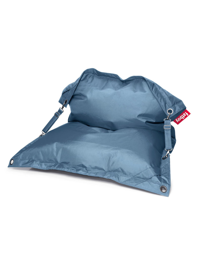 Fatboy Buggle-Up light blue jeans bean bag chair, versatile and water-repellent, with adjustable straps for solo or duo seating, ideal for indoor use.