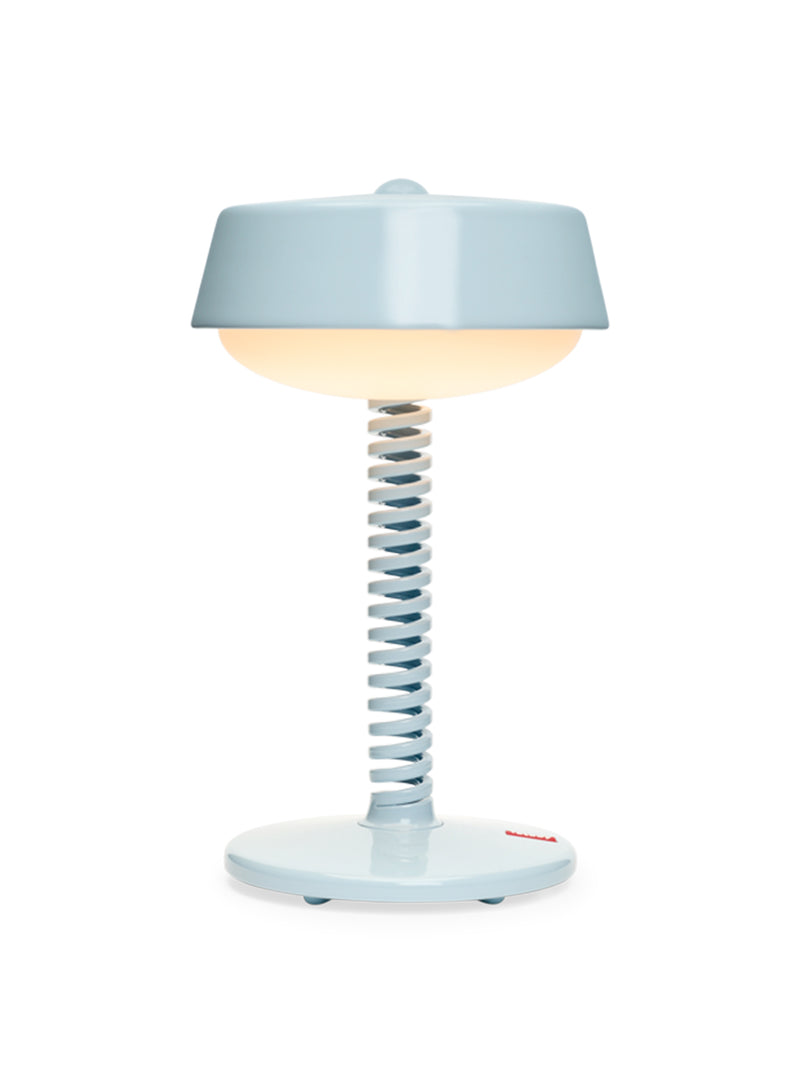 Fatboy Bellboy table lamp in jet blue, cordless and dimmable with rechargeable LED light, perfect for indoor and outdoor use.