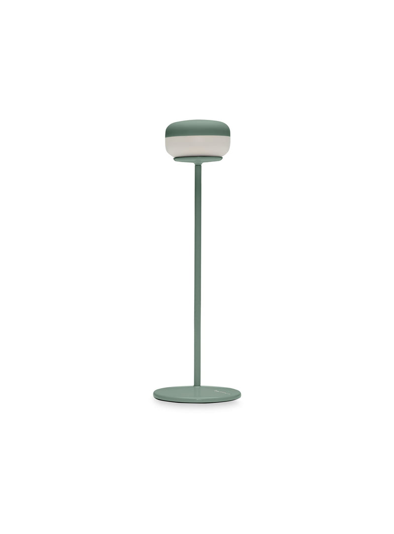 Fatboy Cheerio table lamp in sage color, cordless and rechargeable with adjustable brightness, ideal for ambient lighting in any space.