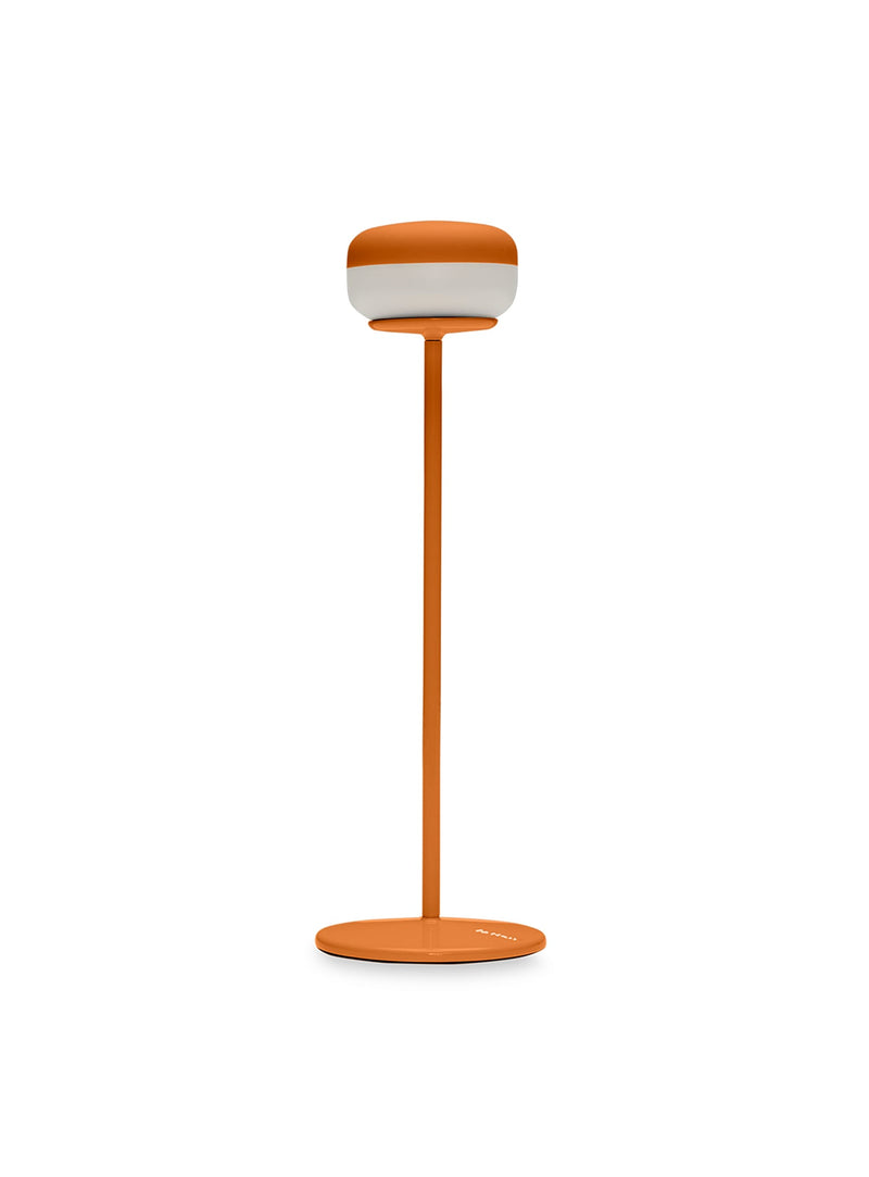 Cheerio cordless table lamp in Sunny Orange with powder-coated metal base, dimmable LED lamp for indoor and outdoor use.”
