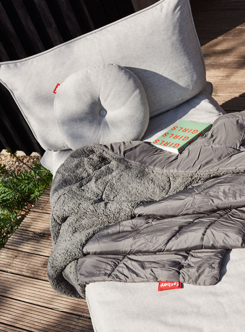 Fatboy Circle Pillow, a weather-resistant outdoor throw pillow, perfect for adding comfort and style to Canadian patios and pool decks.