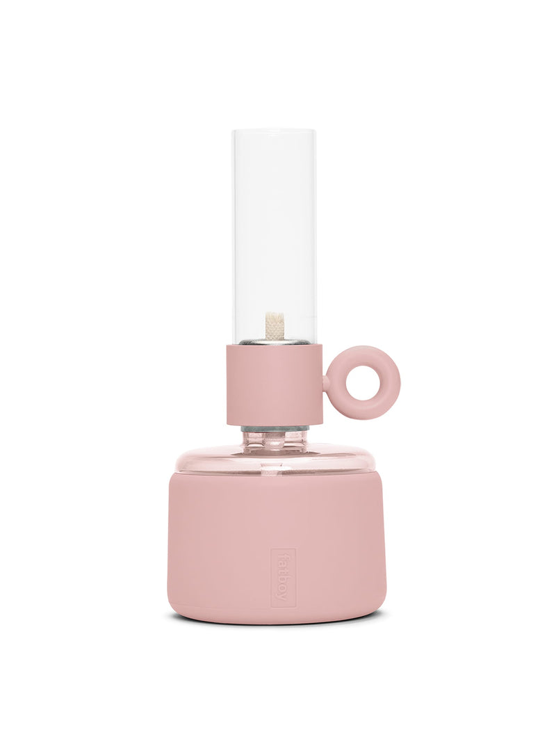 Flamtastique XS oil lamp in Soft Pink with matte silicone finish, modern table lamp made of borosilicate glass for indoor and outdoor ambiance.