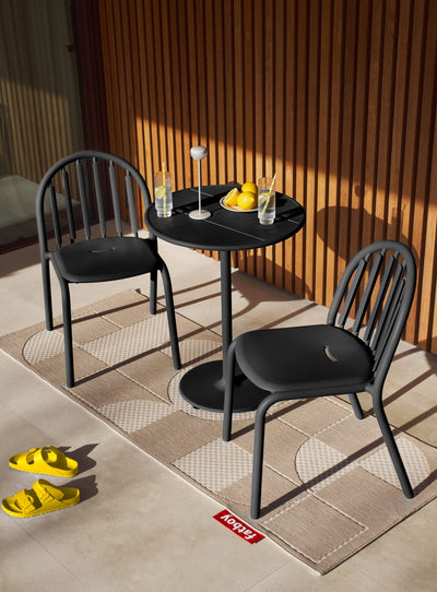 Fred's Bistro Set on a patio featuring a compact table with two chairs in sleek anthracite perfect for stylish outdoor dining spaces.