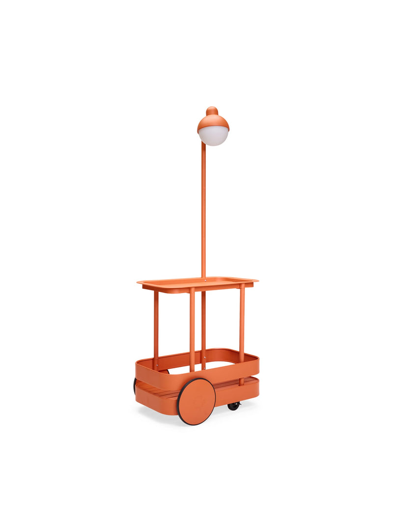 Fatboy Jolly Trolley in tangerine color, versatile outdoor cart with removable tray and built-in LED light, perfect for Canadian gatherings and entertaining.