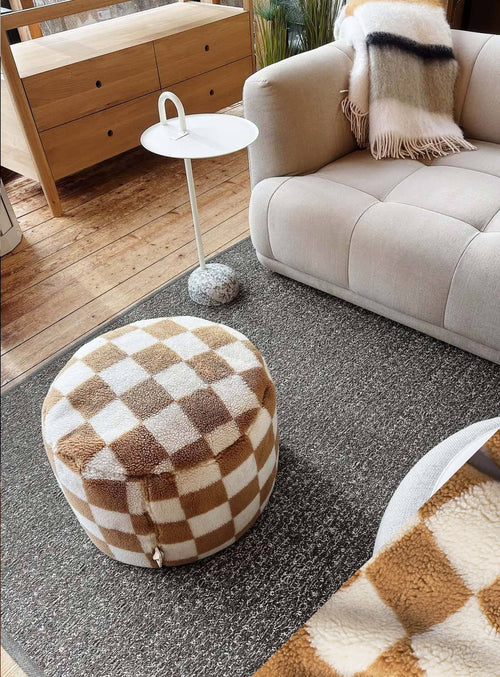 Bring cozy charm and texture to your space with the Fatboy Point Teddy Chess. This plush checkered pouf, made with ultra-soft teddy fabric and a sturdy non-slip base, adds comfort and style to any room.